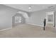 Spacious bonus room with large window and stairway access at 12404 Beauvoir St, Raleigh, NC 27614