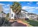 Exterior of home with an enclosed porch and manicured landscaping at 12404 Beauvoir St, Raleigh, NC 27614