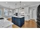 Kitchen with stainless steel appliances, an island, and a breakfast nook at 12404 Beauvoir St, Raleigh, NC 27614