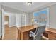 Office space with natural light, hardwood flooring, and a classic wooden desk at 12404 Beauvoir St, Raleigh, NC 27614