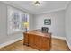 Bright office with hardwood floors, crown molding, and a large wooden desk at 12404 Beauvoir St, Raleigh, NC 27614
