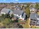 Aerial view showcases the home's fenced yard, screened in porch, and multi-level deck at 12404 Beauvoir St, Raleigh, NC 27614