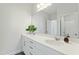 Bathroom with double sinks, white cabinets and modern fixtures at 125 Scotland Dr, Youngsville, NC 27596