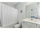 Bathroom with combined shower and tub and featuring a large white vanity at 125 Scotland Dr, Youngsville, NC 27596