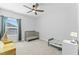 Bedroom with carpeted floors, a crib and window providing natural light at 125 Scotland Dr, Youngsville, NC 27596