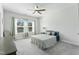 Comfortable bedroom with carpeted floors, ceiling fan and natural light from the windows at 125 Scotland Dr, Youngsville, NC 27596