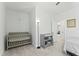 Bedroom with carpeted floors, a crib, a changing table and window providing natural light at 125 Scotland Dr, Youngsville, NC 27596