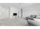 Spacious bonus room with plush carpeting, a comfortable couch, and TV area at 125 Scotland Dr, Youngsville, NC 27596