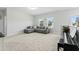 Upstairs bonus room featuring a comfy sofa and piano and lots of natural light at 125 Scotland Dr, Youngsville, NC 27596