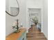 Inviting entryway featuring hardwood floors, a decorative table with a vintage candelabra, and a view into the living spaces at 125 Scotland Dr, Youngsville, NC 27596