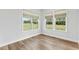 Sunlit bonus room with durable flooring and large windows overlooking the backyard at 125 Scotland Dr, Youngsville, NC 27596