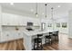 Modern kitchen features a center island with barstool seating and stainless appliances at 125 Scotland Dr, Youngsville, NC 27596