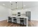 Modern kitchen with a large island, stainless steel appliances, and sleek countertops at 125 Scotland Dr, Youngsville, NC 27596