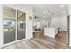 Living area visible from modern kitchen with sliding glass door access to deck at 125 Scotland Dr, Youngsville, NC 27596