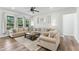 Cozy living room with comfortable seating, accent mirror, and ample natural light at 125 Scotland Dr, Youngsville, NC 27596