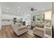 Inviting living room flows into kitchen, with modern furnishings, and natural light at 125 Scotland Dr, Youngsville, NC 27596