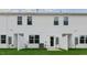 Townhome backyard area with grassy lawn and a partial fence for privacy at 168 Starlight St, Sanford, NC 27330