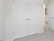 Neutral space featuring double closet doors and access to an additional room at 168 Starlight St, Sanford, NC 27330