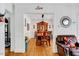 Bright dining room with hardwood floors and an archway to another room at 1704 Cypress Dr, Henderson, NC 27536