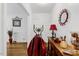 Inviting entryway featuring hardwood floors, console table, decorative mirror, and stylish accent pieces at 1704 Cypress Dr, Henderson, NC 27536