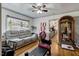 Welcoming living room with a plush sofa, hardwood floors, and ample natural light, creating a cozy and inviting atmosphere at 1704 Cypress Dr, Henderson, NC 27536