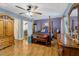 Inviting main bedroom showcasing hardwood floors, a four-poster bed, and ample natural light, creating a comfortable retreat at 1704 Cypress Dr, Henderson, NC 27536