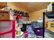 Rustic storage area with exposed brick, plywood walls and ceiling, and shelving, ideal for organization at 1704 Cypress Dr, Henderson, NC 27536