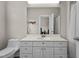 Bathroom featuring a white vanity, a large mirror, and a toilet at 199 Black Cloud Dr, Louisburg, NC 27549