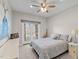Comfortable bedroom with plush bedding, dresser, and access to the outdoors at 199 Black Cloud Dr, Louisburg, NC 27549