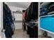Walk-in closet with ample storage space on both sides and a carpeted floor at 199 Black Cloud Dr, Louisburg, NC 27549