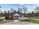A clubhouse with an American flag and a ramp leading to the front entrance at 199 Black Cloud Dr, Louisburg, NC 27549