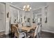 An open dining room with dark floors and views to other parts of the home at 199 Black Cloud Dr, Louisburg, NC 27549