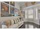 Cozy living room with unique decor, hardwood floors, and a bay window at 199 Black Cloud Dr, Louisburg, NC 27549