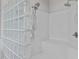 Modern shower with glass block wall, shower bench, and handheld shower head at 199 Black Cloud Dr, Louisburg, NC 27549