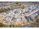 Aerial shot showcasing a community neighborhood with modern homes and lush landscaping, creating a welcoming atmosphere at 201 Bluffwood Avenue, Chapel Hill, NC 27516
