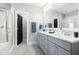 Elegant bathroom with double vanity, white countertops, and modern fixtures at 201 Bluffwood Avenue, Chapel Hill, NC 27516