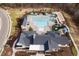 Aerial view of community pool featuring a large swimming area, sun loungers, cabanas and bocce ball court for residents' enjoyment at 201 Bluffwood Avenue, Chapel Hill, NC 27516