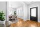 Bright dining room with wood floors, modern lighting, and views of the exterior at 201 Bluffwood Avenue, Chapel Hill, NC 27516