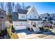 Charming two-story home with a welcoming front porch and well-manicured landscaping for curb appeal at 201 Bluffwood Avenue, Chapel Hill, NC 27516