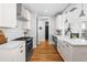 Bright and modern kitchen with subway tile backsplash, stainless appliances, and hardwood flooring at 201 Bluffwood Avenue, Chapel Hill, NC 27516