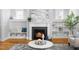 Cozy living room with a fireplace, hardwood floors, and stylish decor, creating a warm and inviting atmosphere at 201 Bluffwood Avenue, Chapel Hill, NC 27516