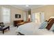 Bedroom featuring neutral walls, carpet, plantation shutters, and dark wood furniture at 201 Hales Wood Rd, Chapel Hill, NC 27517