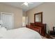 Bedroom featuring a ceiling fan, dresser, and a comfortable bed, creating a relaxing and cozy atmosphere for rest and relaxation at 201 Hales Wood Rd, Chapel Hill, NC 27517