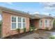 Charming brick home featuring beautiful trimmed windows and an elegant roofline at 201 Hales Wood Rd, Chapel Hill, NC 27517