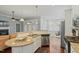 Open concept kitchen with granite counter tops, stainless appliances and an eat-in bar at 201 Hales Wood Rd, Chapel Hill, NC 27517