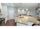 Bright kitchen with eat-in bar area open to dining and living rooms at 201 Hales Wood Rd, Chapel Hill, NC 27517