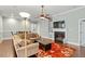 Comfortable living room with a fireplace, built-ins, and hardwood flooring at 201 Hales Wood Rd, Chapel Hill, NC 27517