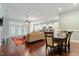 Open-concept living space with hardwood floors connecting the living, dining, and kitchen areas at 201 Hales Wood Rd, Chapel Hill, NC 27517