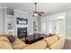 Cozy living room with a fireplace, built-in shelving, and plush furniture at 201 Hales Wood Rd, Chapel Hill, NC 27517