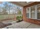 Covered patio area featuring beautiful brickwork and view of private backyard and fence at 201 Hales Wood Rd, Chapel Hill, NC 27517